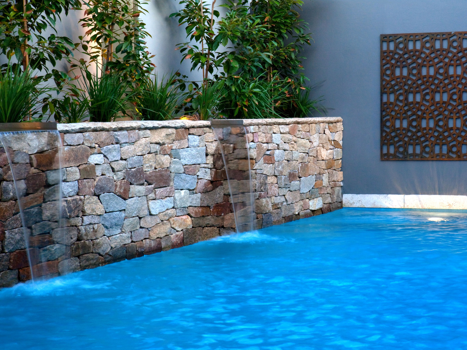 Alpine dry stone walling pool water feature 
