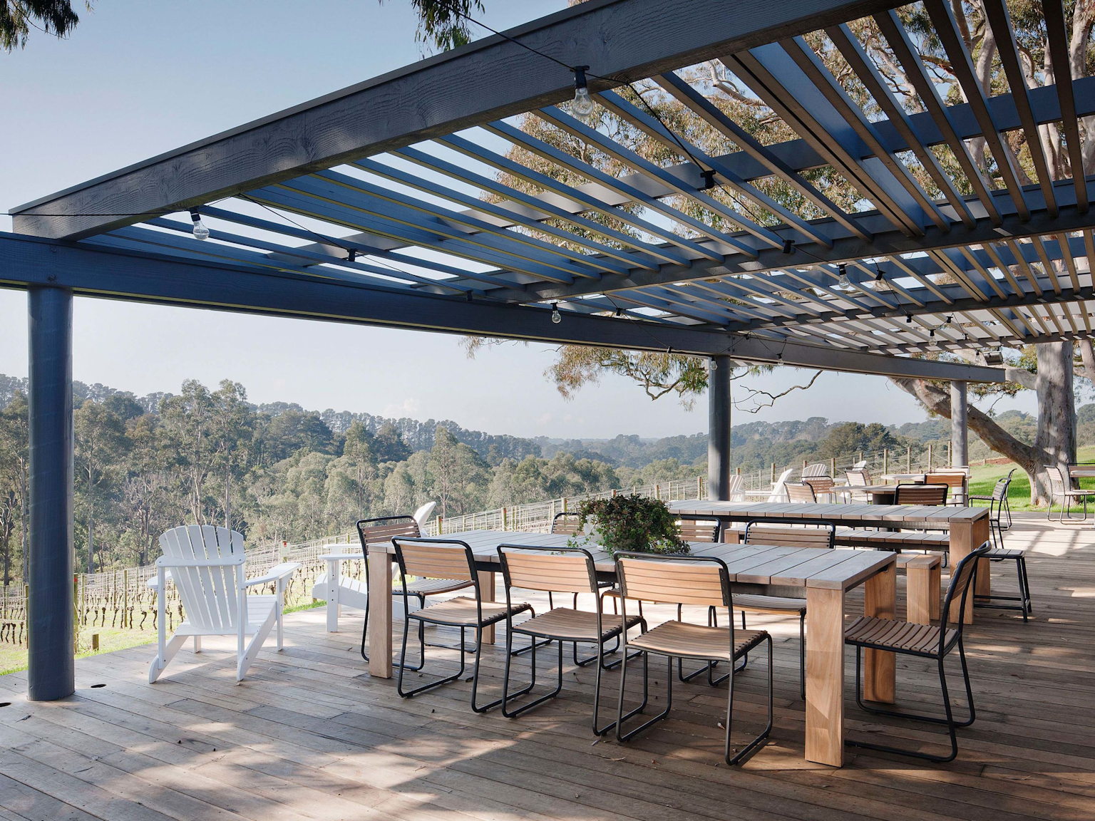 Polperro winery outdoor space overlooking the vineyards, showing Turon dining chairs and the Bronte outdoor dining table