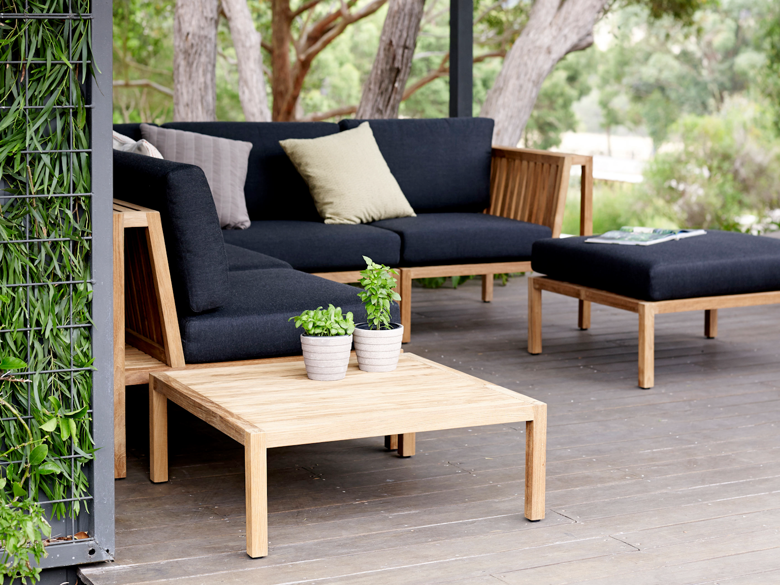 Watego modular in Basics outdoor fabric with Watego ottoman and low table in outdoor entertainment area