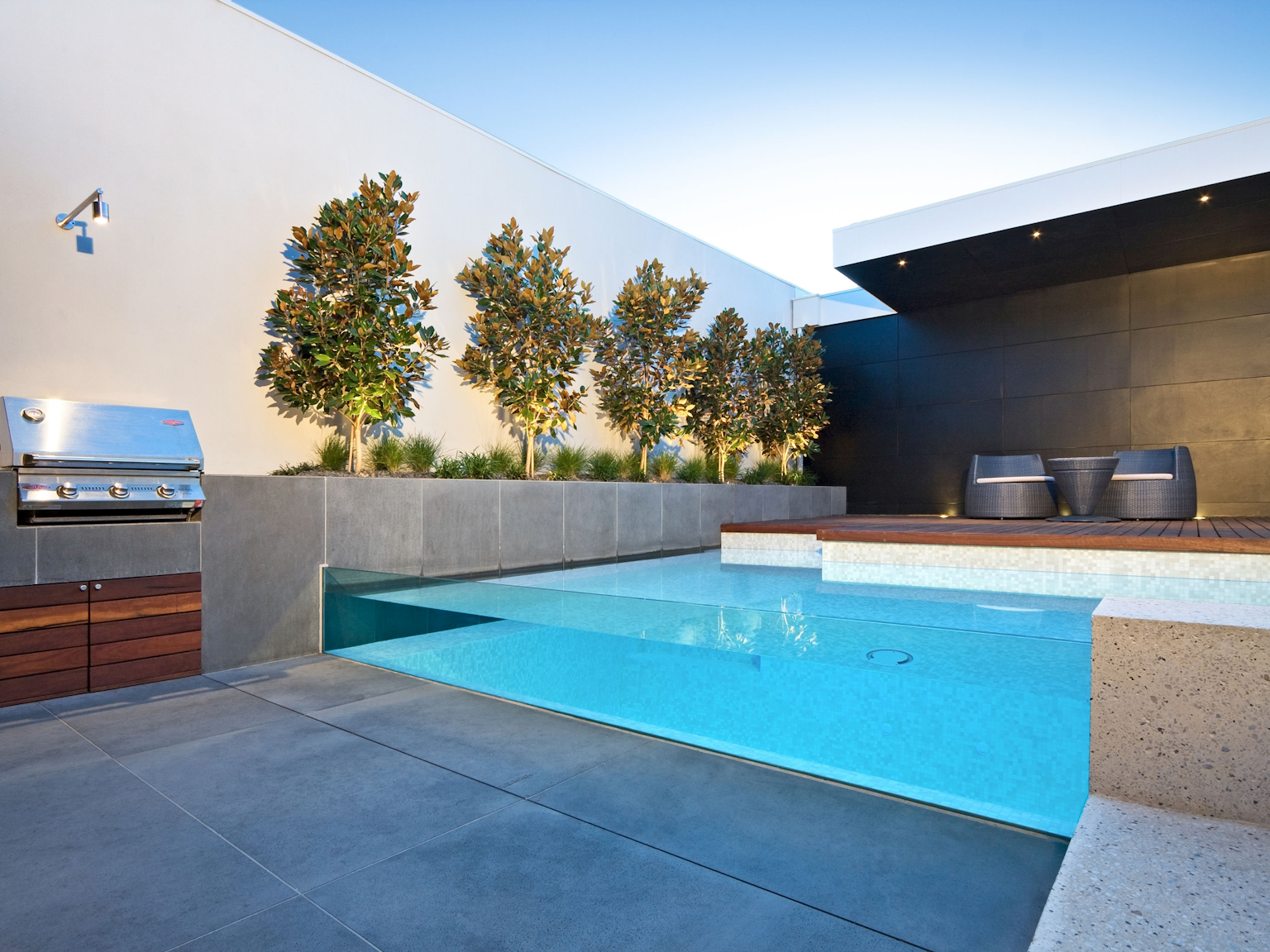 Large format bluestone pavers used as flooring and walling in pool area 
