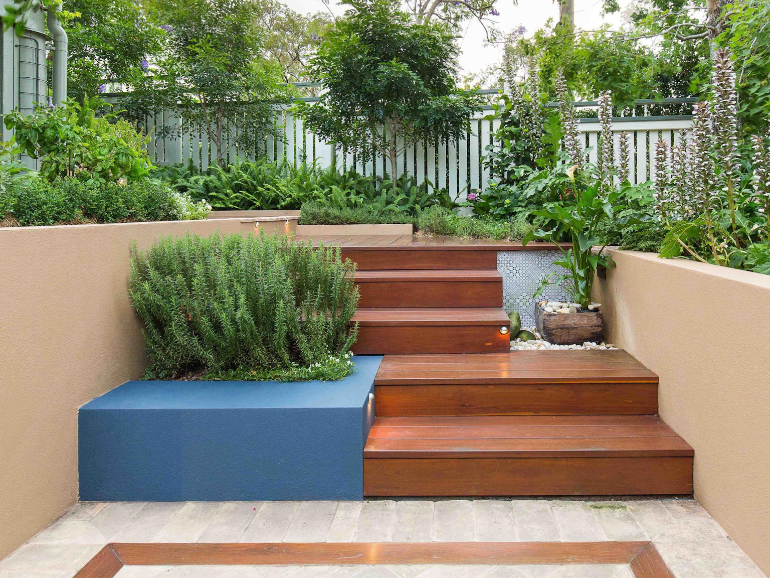 Antico Luce terracotta stone leading to timber decking stairs 
