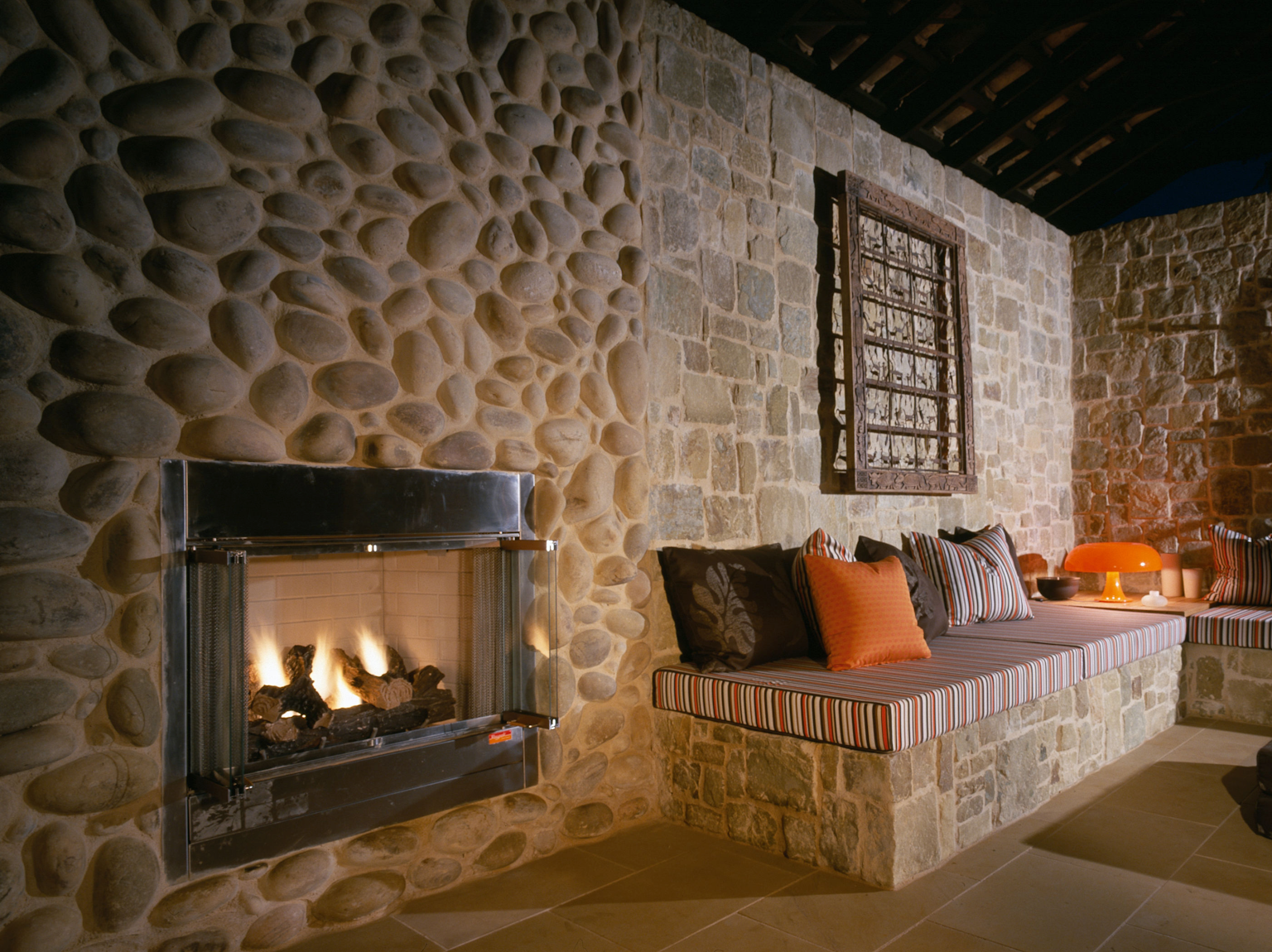 Large format Eggshell pebbles used as fireplace cladding, also showing Clancy random ashlar walling