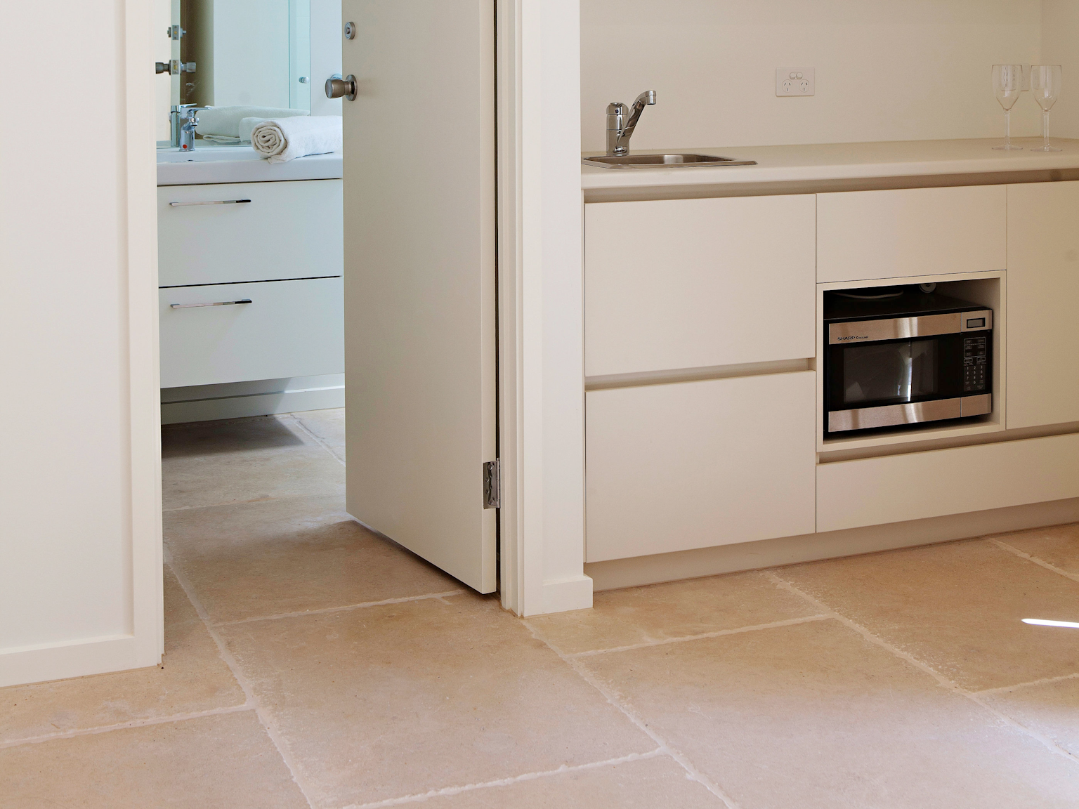 La Roche limestone pavers used internally throughout kitchen and bathroom areas