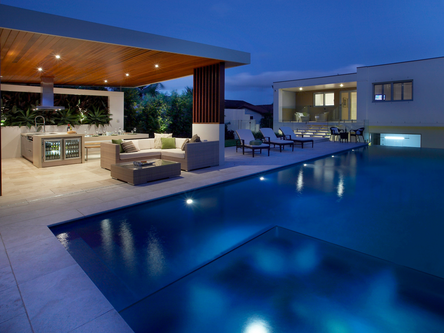 Entertainment and pool area with large format Scala travertine pavers 