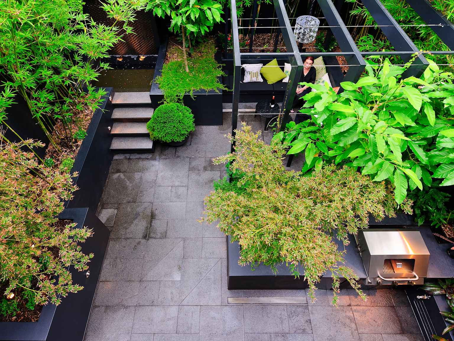 Asian inspired courtyard design with Raven granite modular paving 