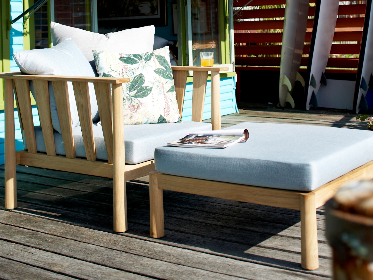 Malua lounge chair and ottoman on wooden deck