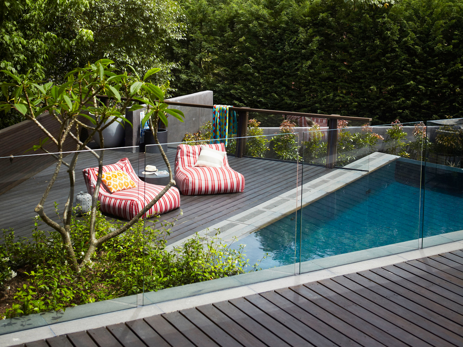 View of pool terrace with custom bluestone drainage grates 
