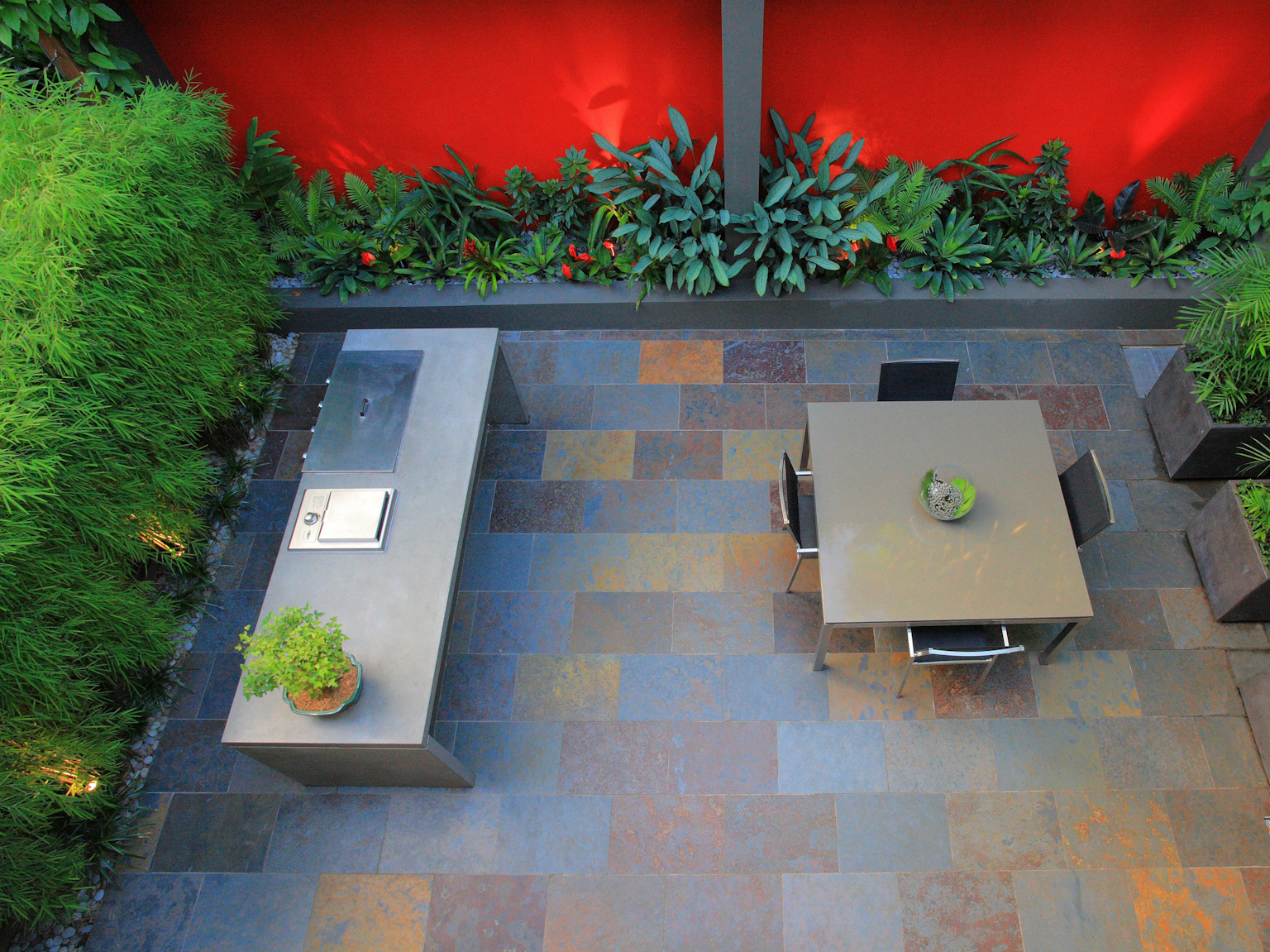 Courtyard design with large format Lichen slate split stone tiles 