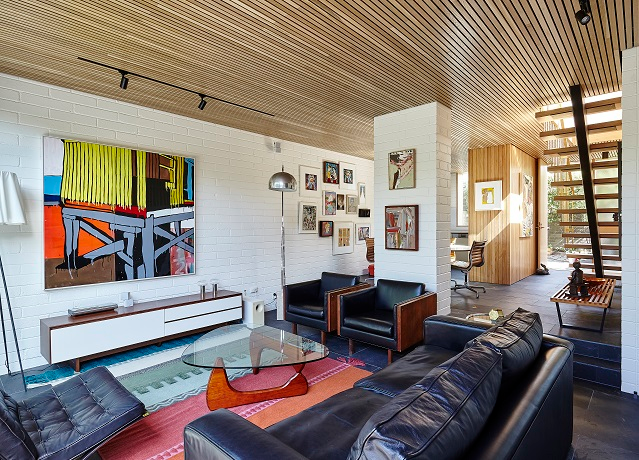 Timber paneling on the ceiling provides warmth and a nod to the past