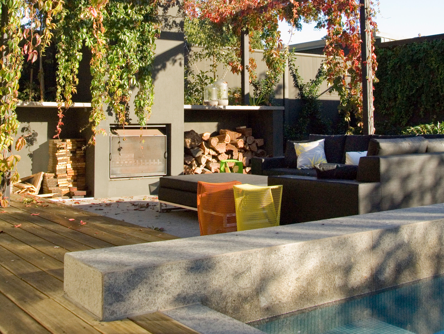 Torino bluestone pool coping with lounge setting and fireplace in background