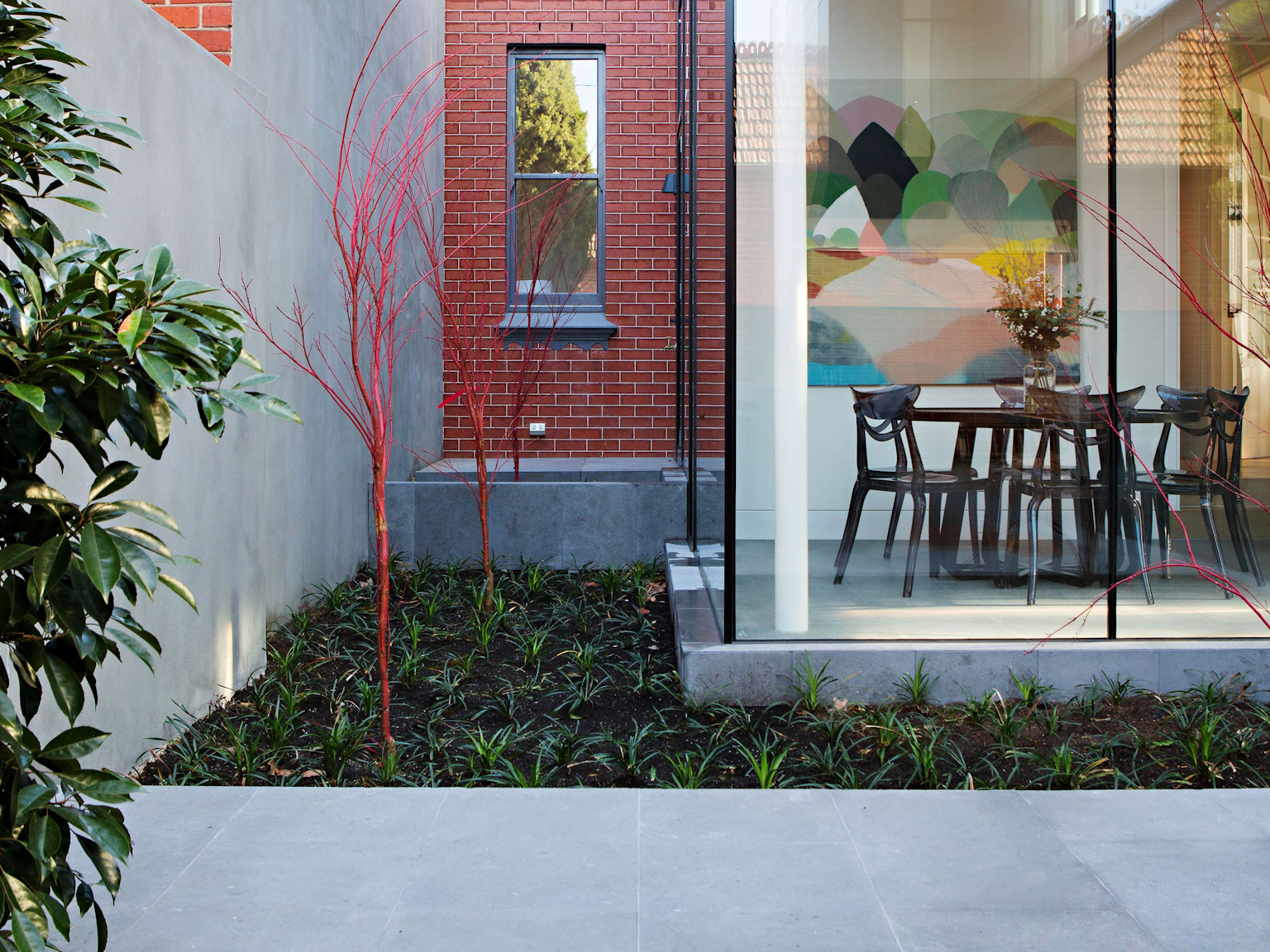 Contemporary geometric design in courtyard with Seville natural stone flooring 