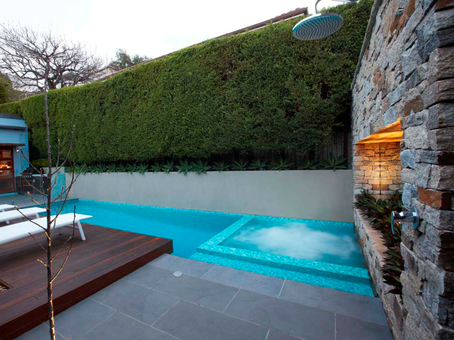 Alpine dry stone feature wall with  bluestone paving and pool coping