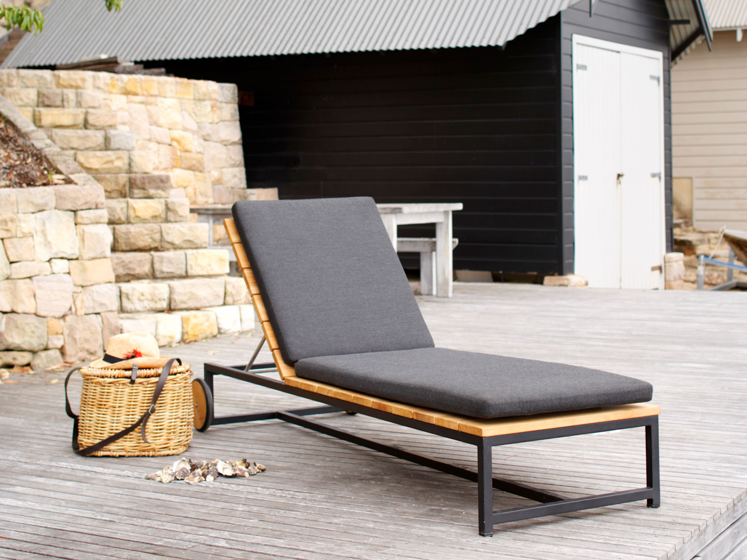 Nullica daybed with cushion in Basics outdoor fabric on wooden deck