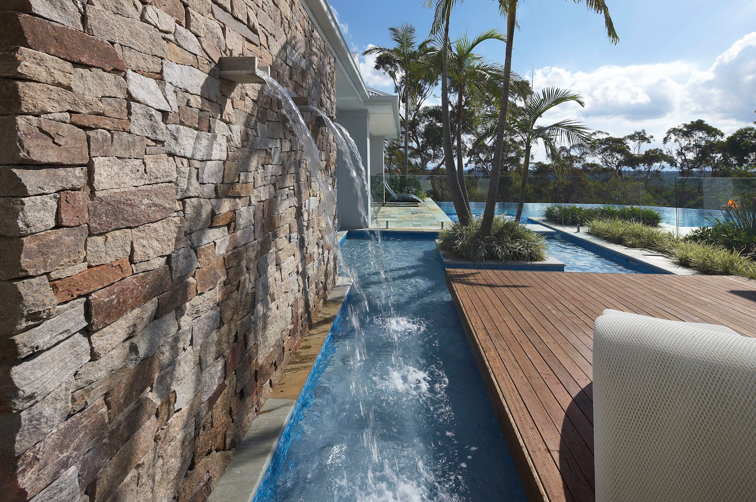 Alpine dry stone walling shown as pool feature wall